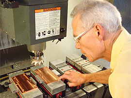 Worker machining copper parts